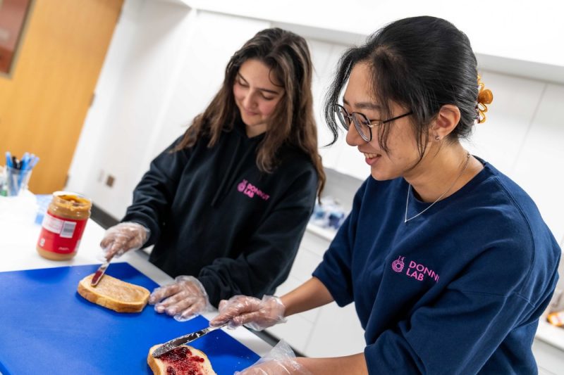 Researchers in the DONNUT Lab prepare peanut butter and Jelly sandwiches