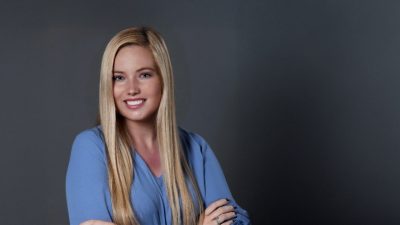 Alexandra Egan standing in front of a grey background